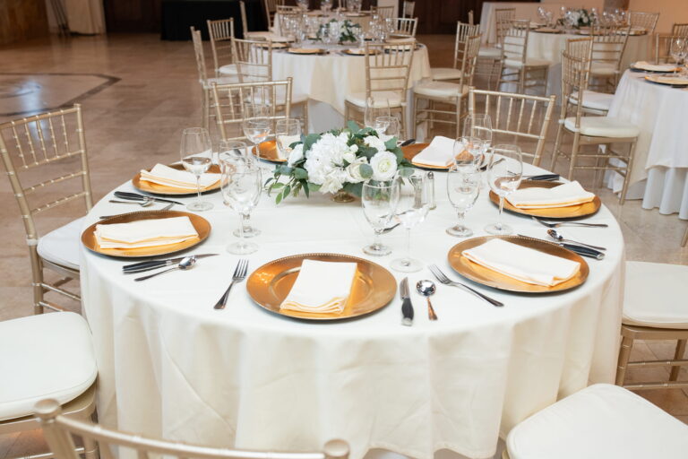 arranged elegance gold white green florals tablesetting reception 1 768x512