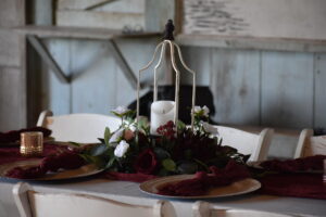 arranged elegance tablescape red greenery gold reception 1 300x200