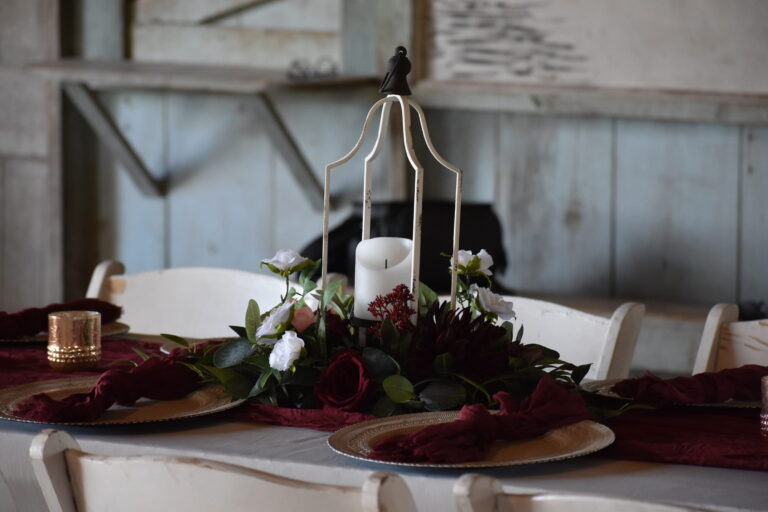 arranged elegance tablescape red greenery gold reception 1 768x512