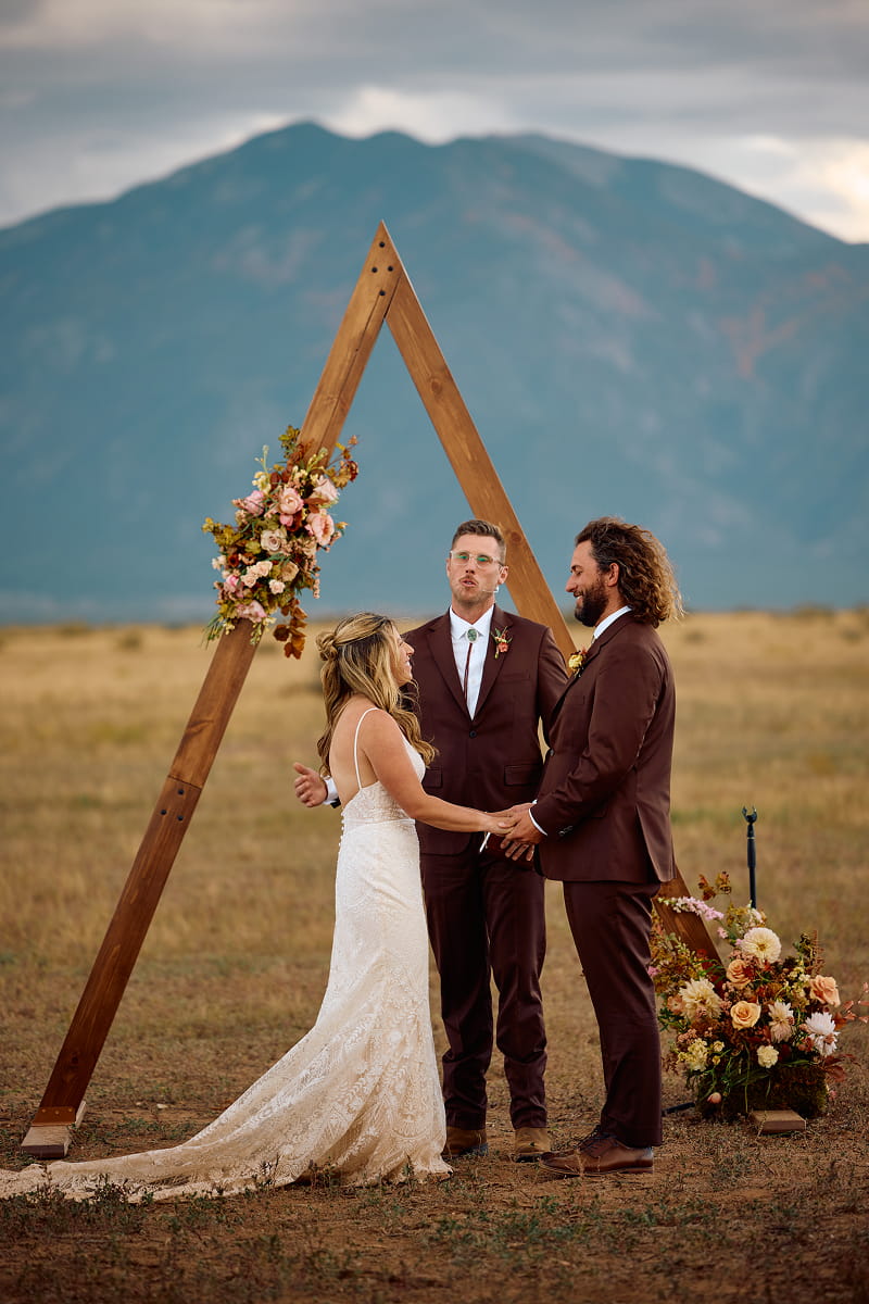 Couple celebrating a wedding at Hotel Luna Mystica in Taos, New Mexico. Photography by Flirt Photography.