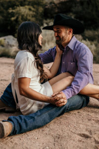 couple sitting holding hands 200x300