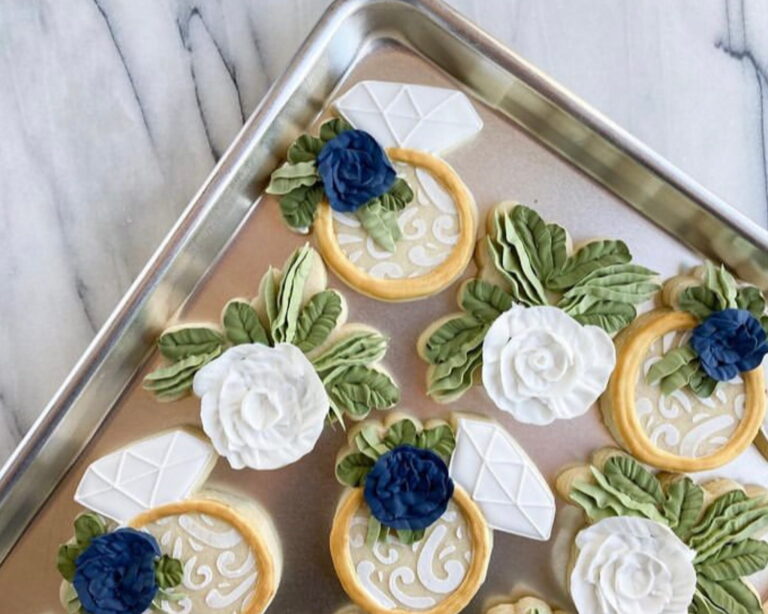 wedding collective 260055440664150 6557131115119622893 Wedding Ring and Floral Decorated Sugar Cookies Sweet Pea Bakery 1 768x614